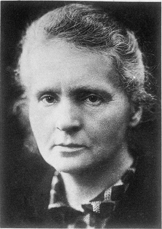 Portrait of Marie Curie, an older woman with her hair tied back