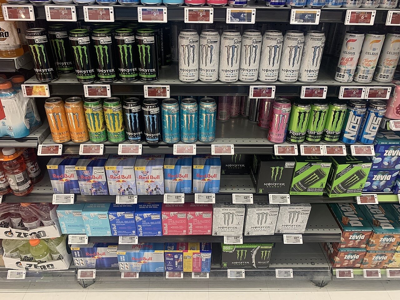 Shop shelves filled with cans of energy drink