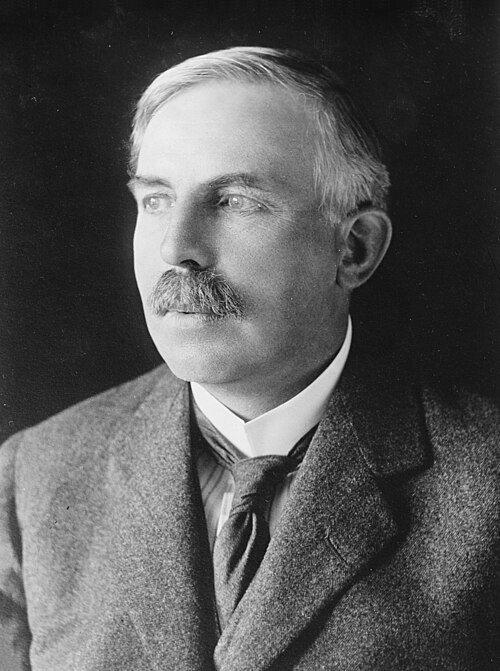 Portrait of Ernest Rutherford, a man with a mustache in a suit