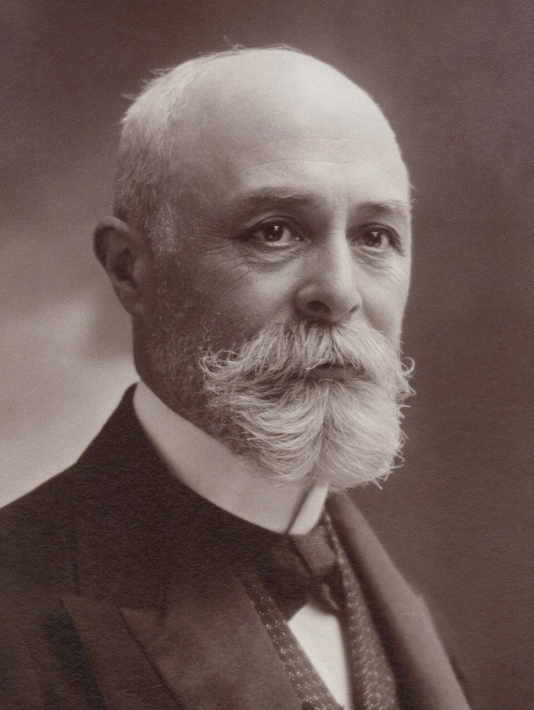 Photographic portrait of Henri Becquerel, a bearded man in a dark suit, seated